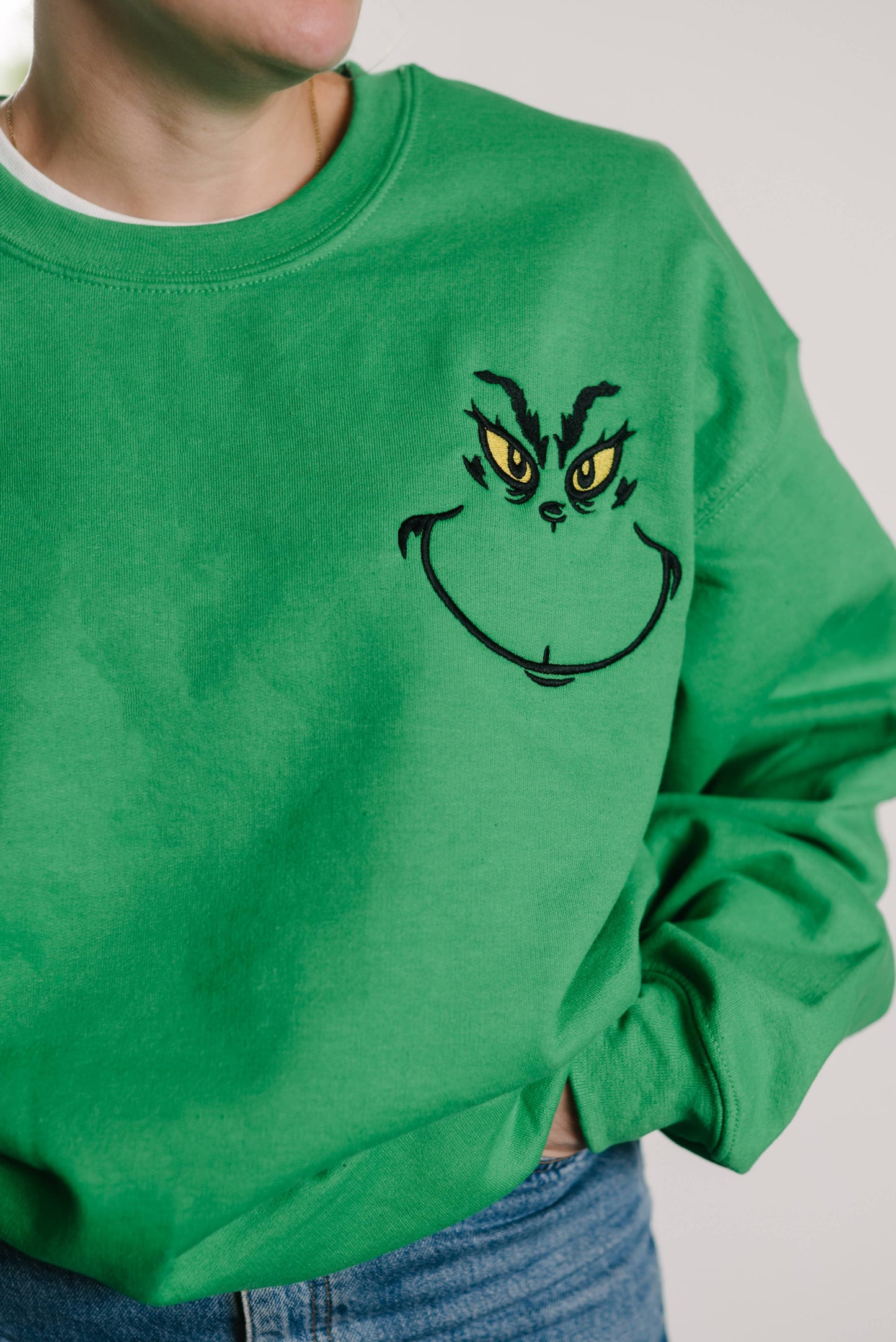 Christmas Grinch Face embroidered crewneck sweater