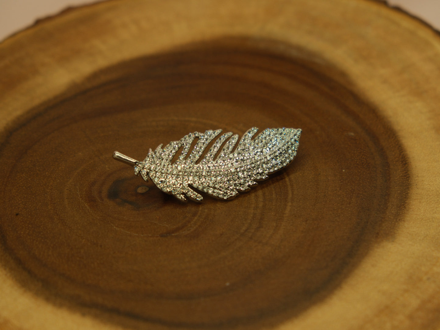 Crystal feather brooch